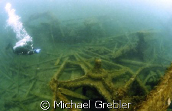 A diver points to the rocker beam of the passenger sidewh... by Michael Grebler 